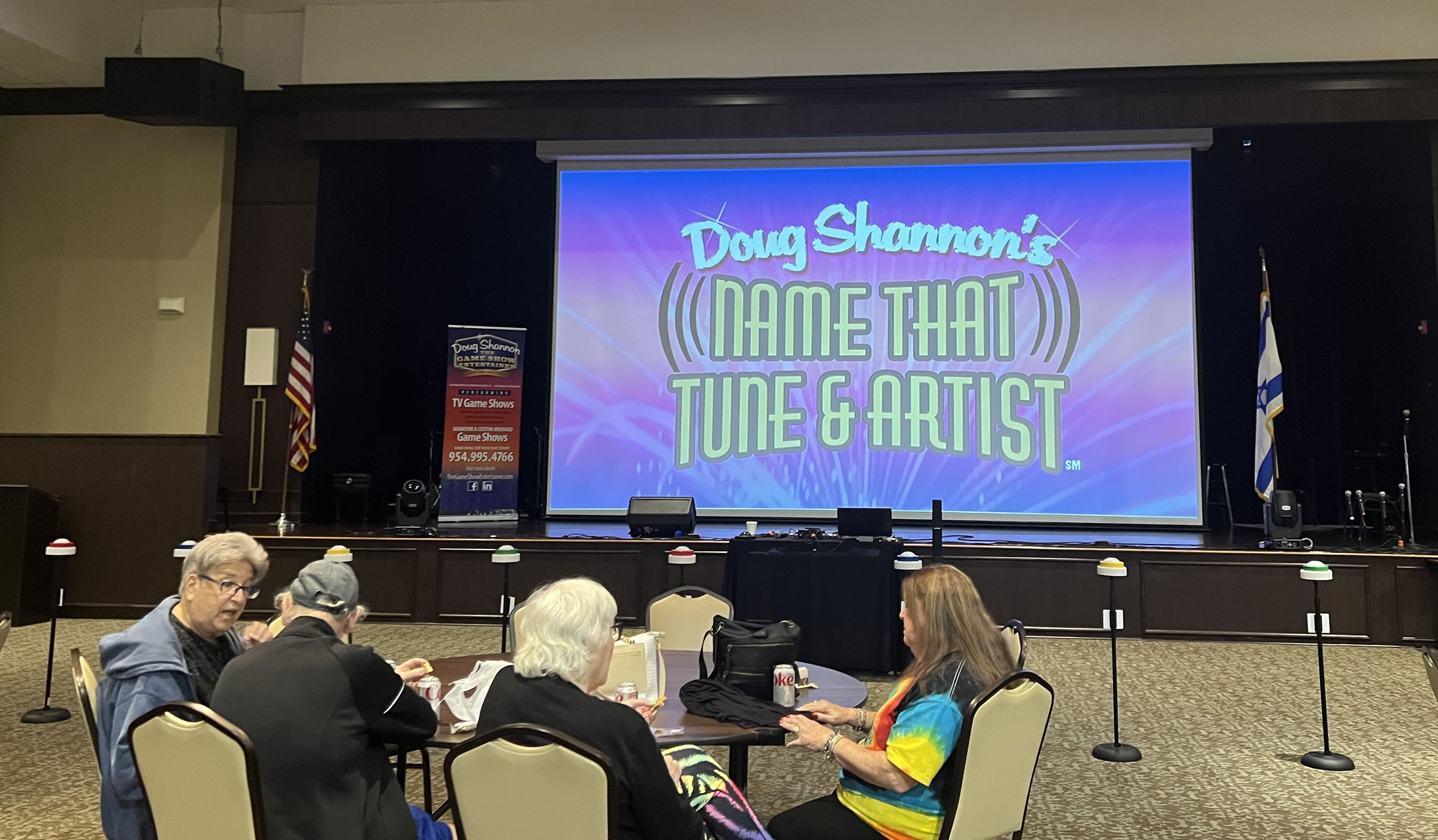 Doug Shannon's Name That Tune and Artist Game Show showing contestants holding game buzzers